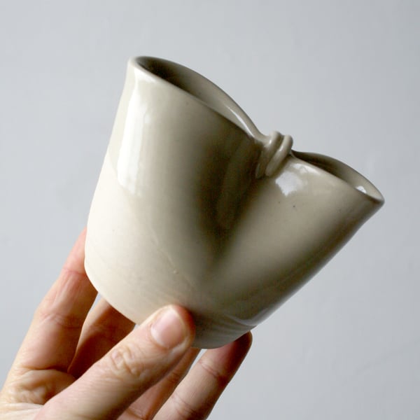 Small handmade folded stoneware pouring jug in simply clay