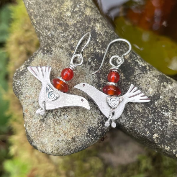 silver bird earrings with juicy orange carnelian.