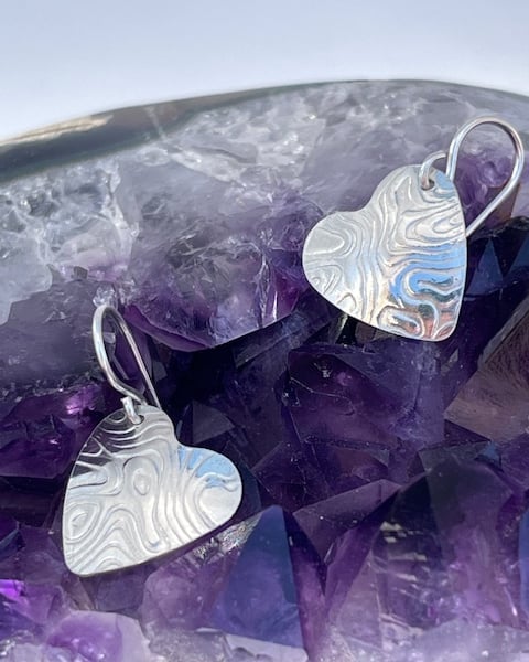 Heart silver round earrings with texture
