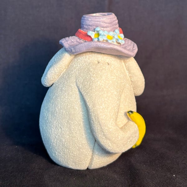 Elephant vase with lilac hat