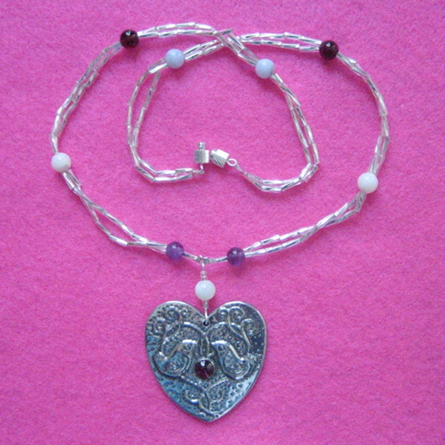 Love birds garnet necklace in silver pewter