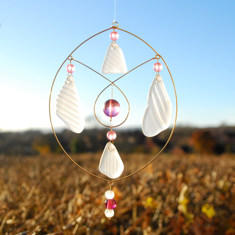 White sea glass sun catcher with pink beads