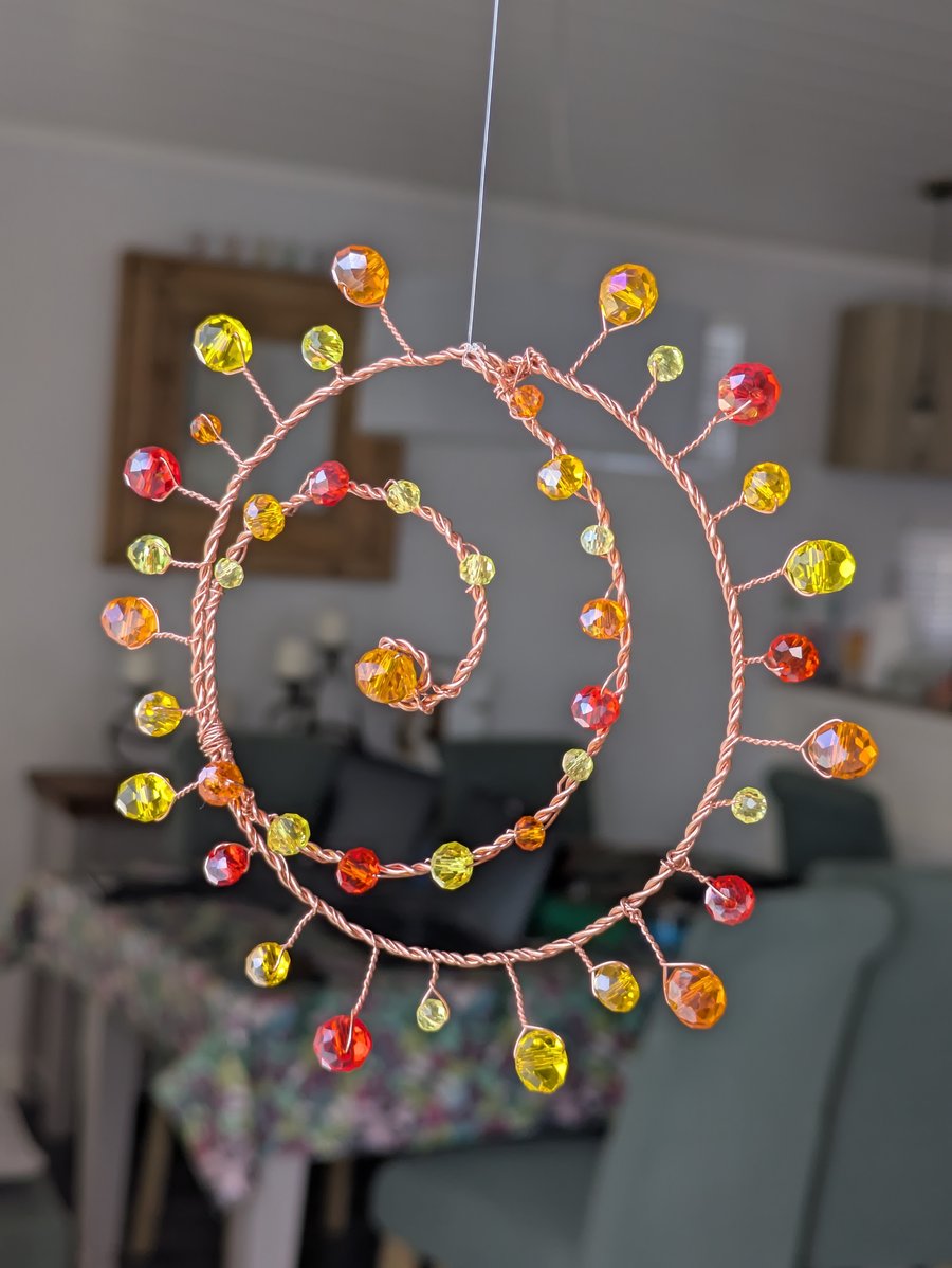 Sun suncatcher, yellow, orange, red, copper wire, glass beads 
