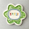 Large Smile pottery magnet green