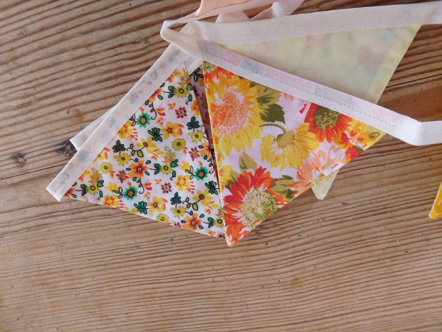 Handmade mini bunting made in an orange and yellow floral theme.