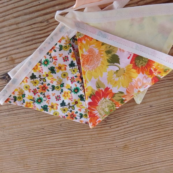Handmade mini bunting made in an orange and yellow floral theme.