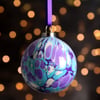 Purple and turquoise marbled ceramic Christmas bauble 