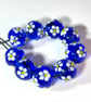 Handmade blue and white daisy patterned lamp work glass beads - Image 3