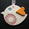 Ceramic patterned bird decoration with heart shaped wing