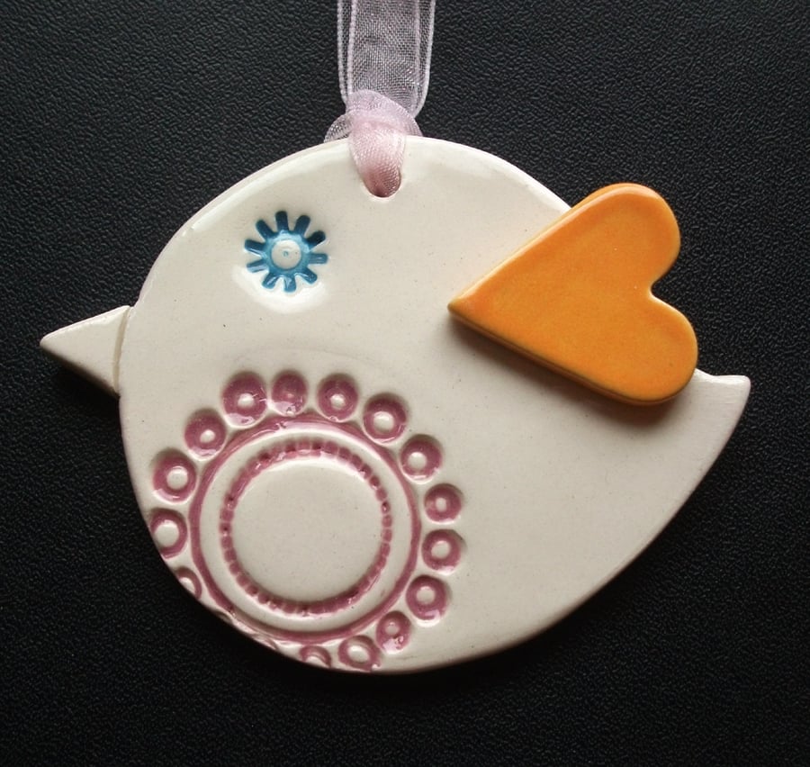 Ceramic patterned bird decoration with heart shaped wing