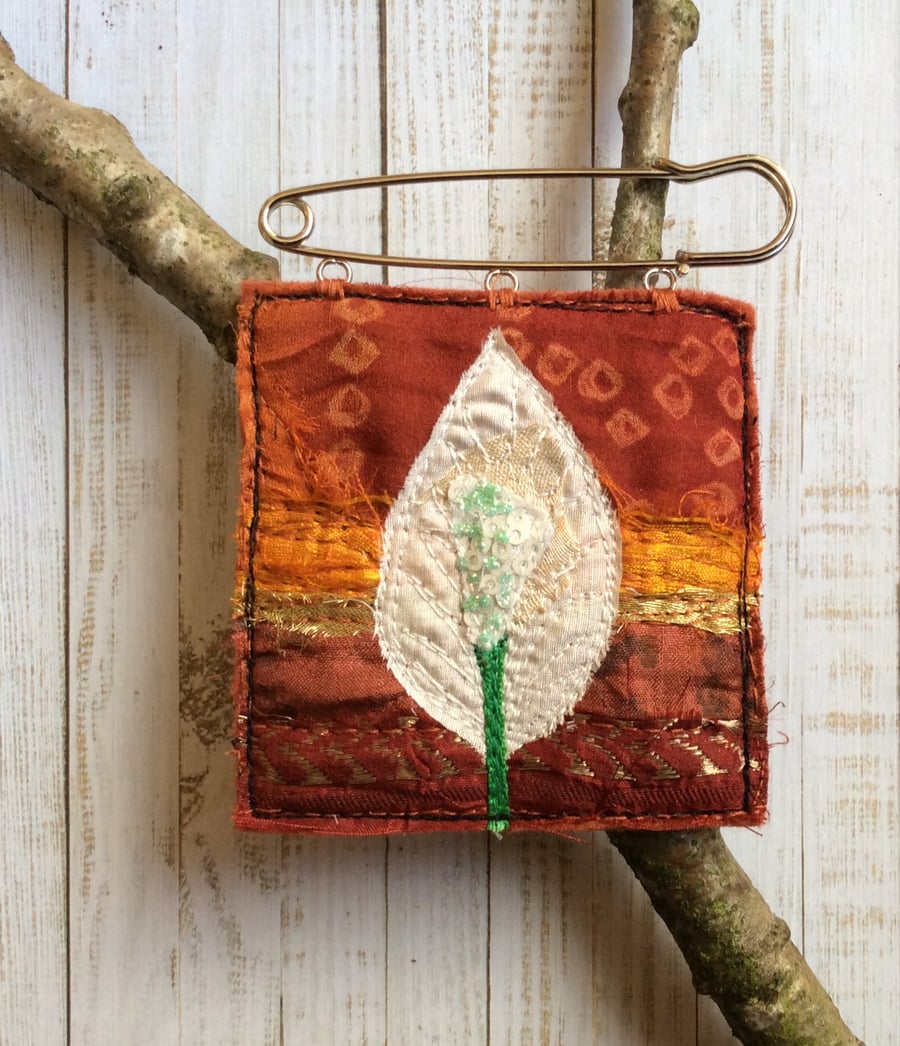 Embroidered flower kilt pin brooch. 