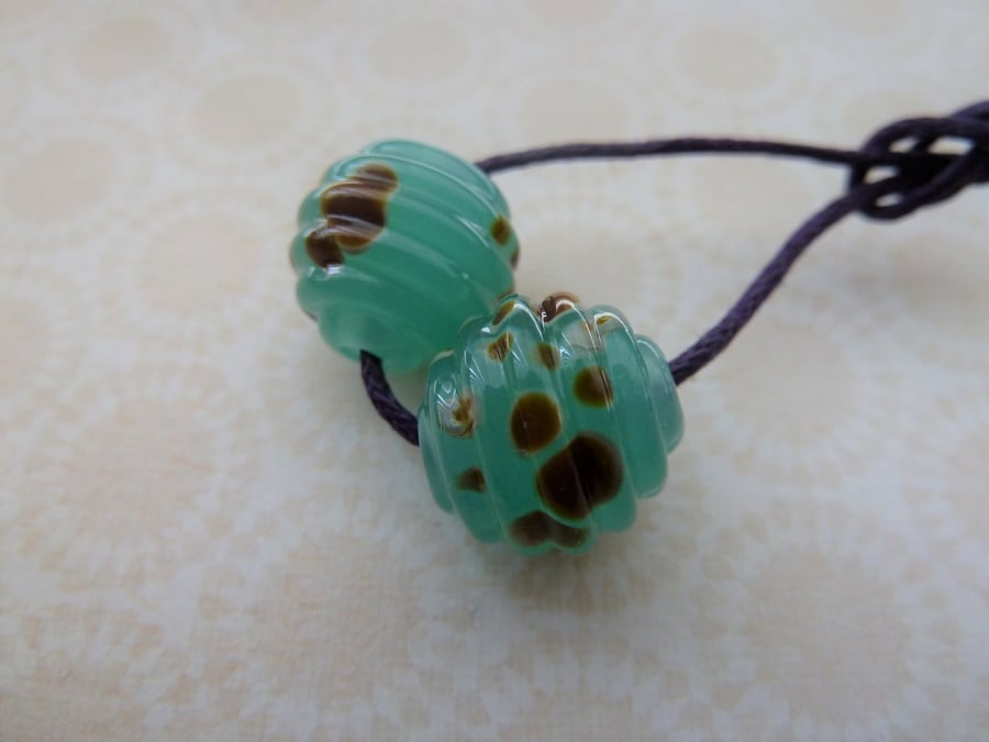handmade lampwork glass beads, green raku ribbed pair
