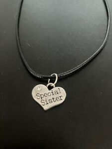 special sister heart charm pendant on a 18" leather cord necklace