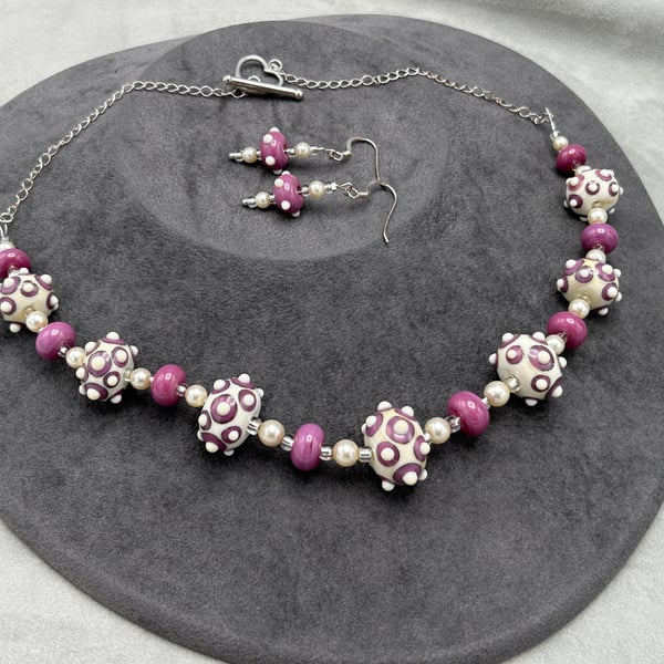 raspberry pink and ivory-cream lampwork glass beaded necklace and earrings