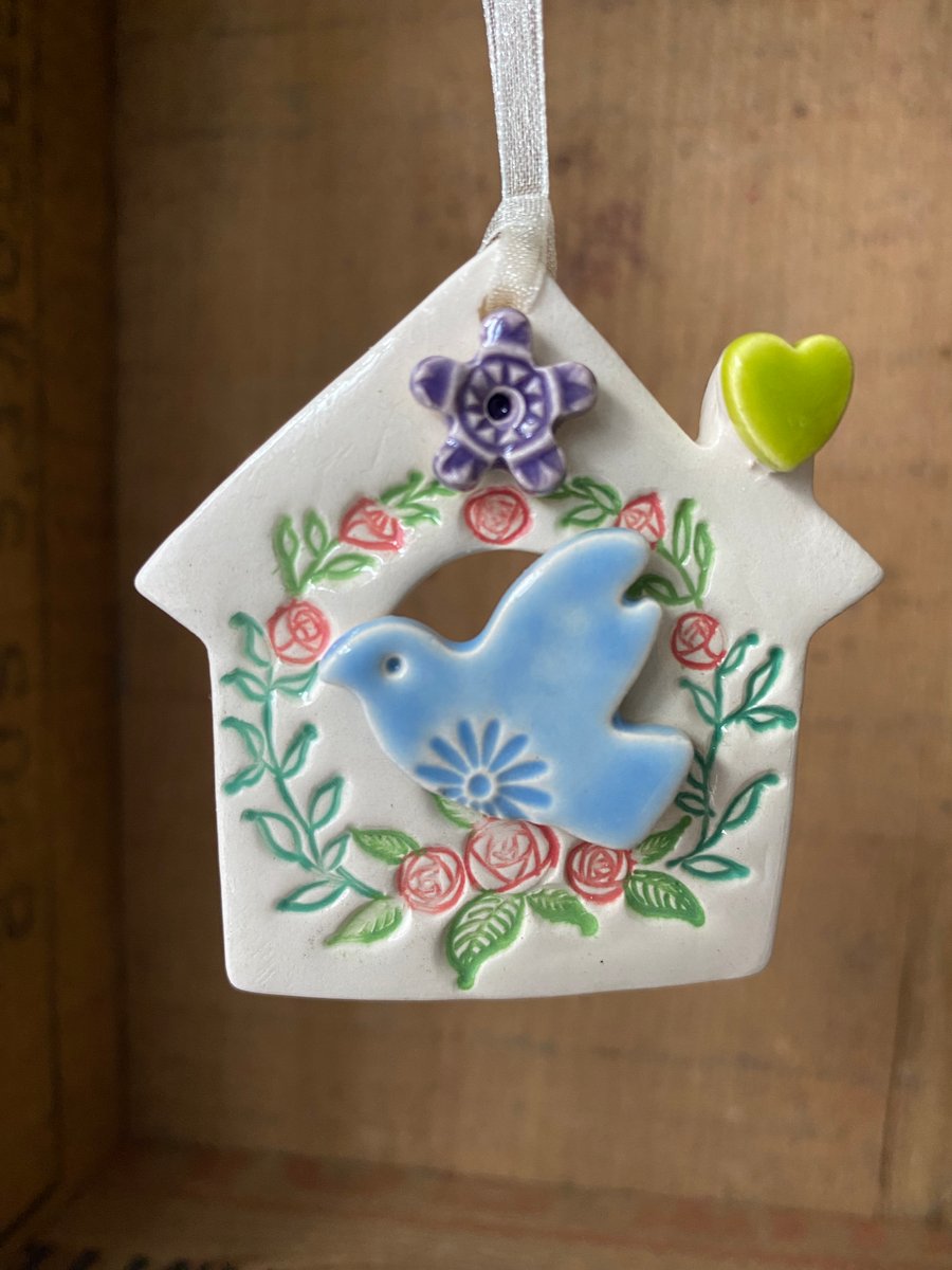 Small Ceramic bird house decoration with purple flower