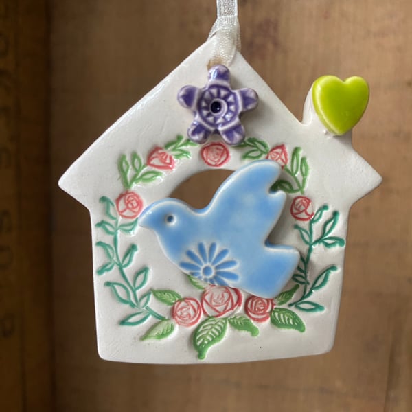 Small Ceramic bird house decoration with purple flower