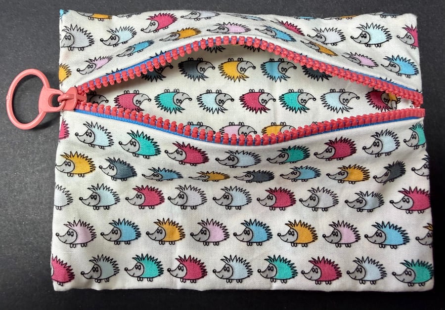 Small funky zipped pouch with tiny colourful hedgehogs