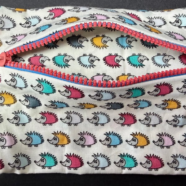 Small funky zipped pouch with tiny colourful hedgehogs