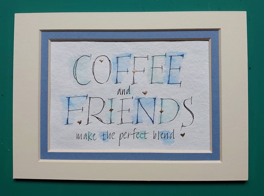 Coffee and Friends quote handwritten in ink with 23c gold detail