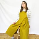 Pleated Split Leg Pinafore Apron with Adjustable Crossback Straps. Mustard