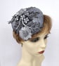 Silver grey pillbox shaped fascinator embellished with applique