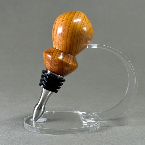 Handmade wine bottle stopper hand turned from Yew wood and stainless steel.