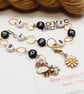 Row Counter Chain with White Number Beads, Enamel Brown Cow and Daisy - Image 2