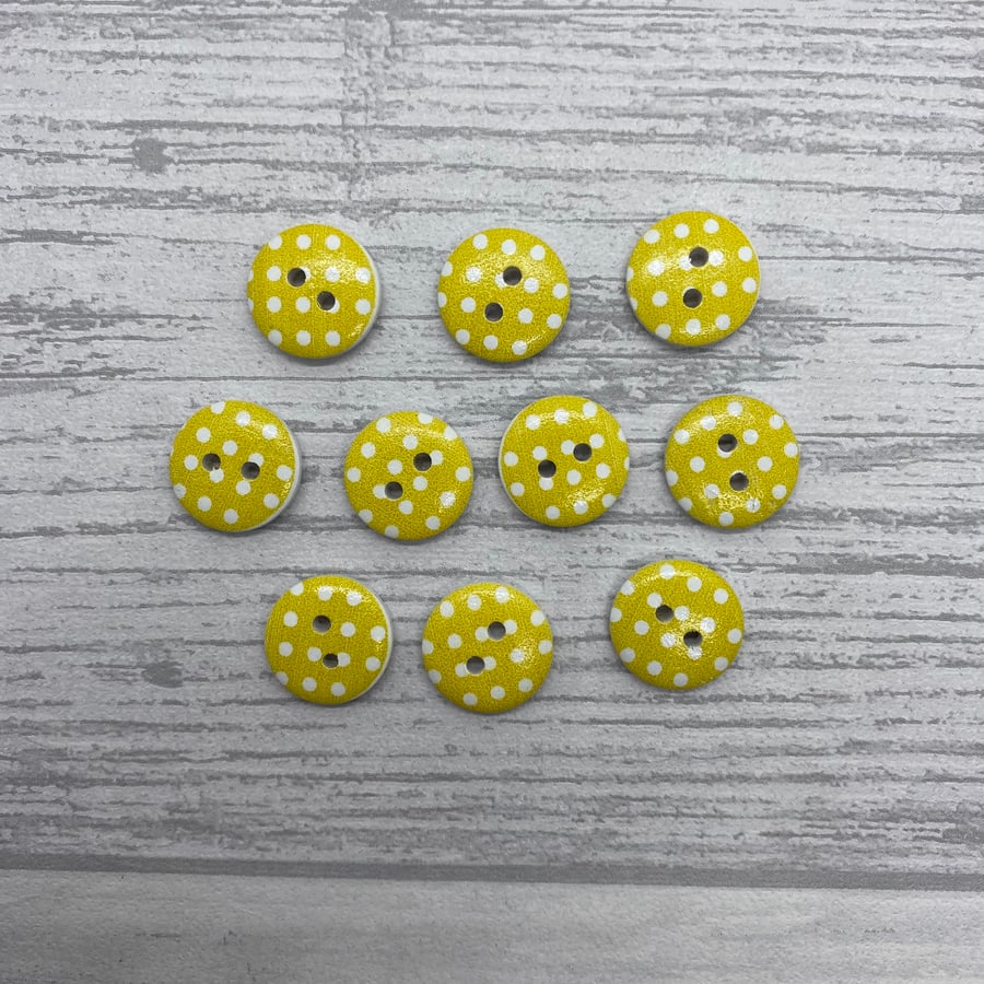 10 round buttons in yellow with white spot