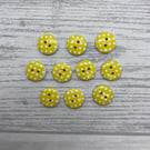 10 round buttons in yellow with white spot