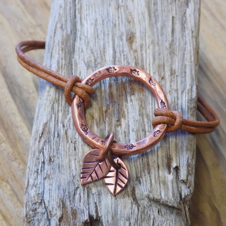 Chunky aged copper hoop 'leaves; leather bracelet 