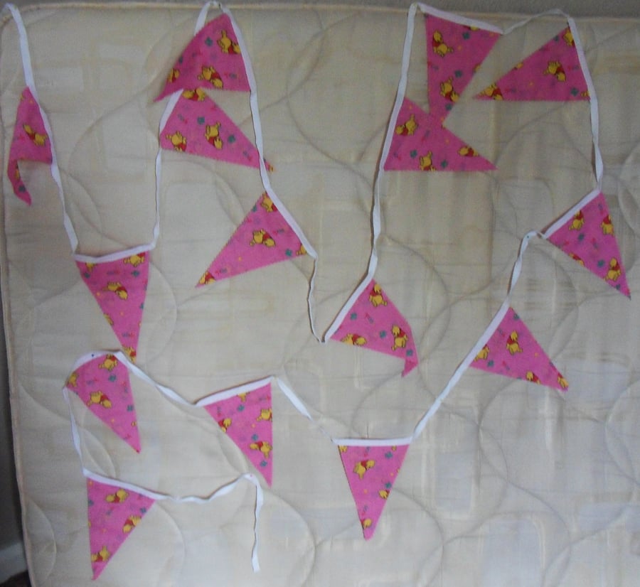 Homemade bunting.  Winnie the Pooh on pink background. 5 meters