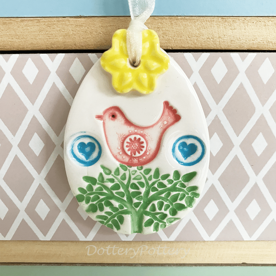 Pottery Easter Egg decoration with pink bird and flower