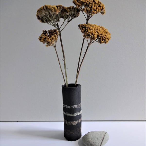 Helen.  Black ceramic vase with bands of colour.