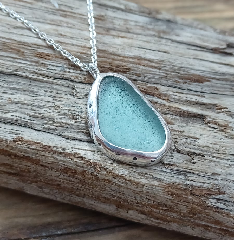 Sea glass necklace set in silver , bezel set 