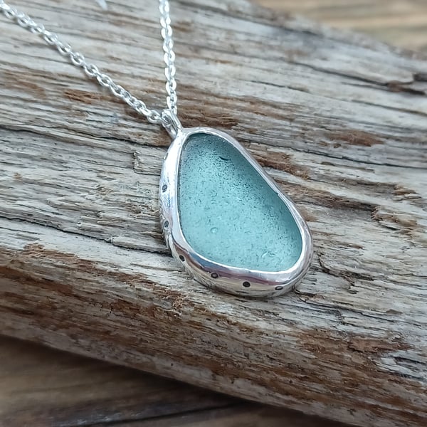 Sea glass necklace set in silver , bezel set 