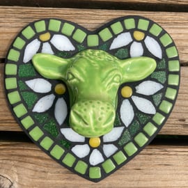 Mosaic wall hanging with lime green ceramic cow head and mosaic daisies.