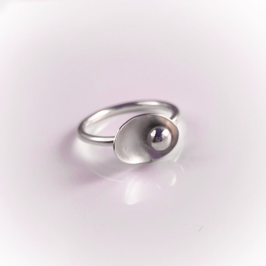 Sterling silver ring with pebble in the petal
