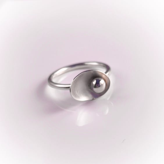 Sterling silver ring with pebble in the petal