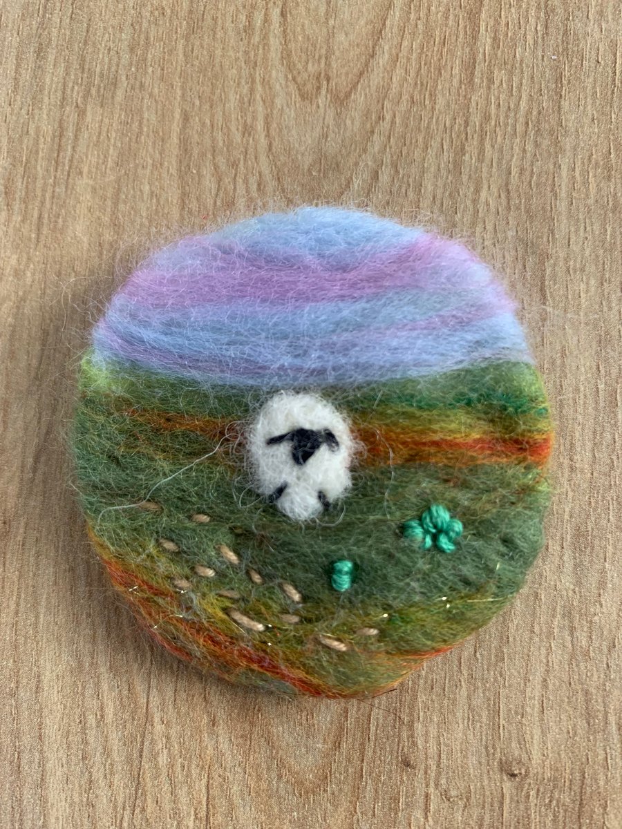 Needle felted sheep in meadow brooch