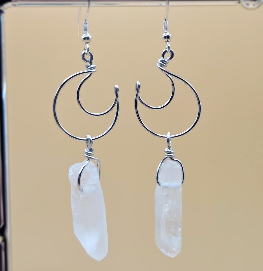 Sterling silver crescent moon dangle earrings with raw clear quartz points