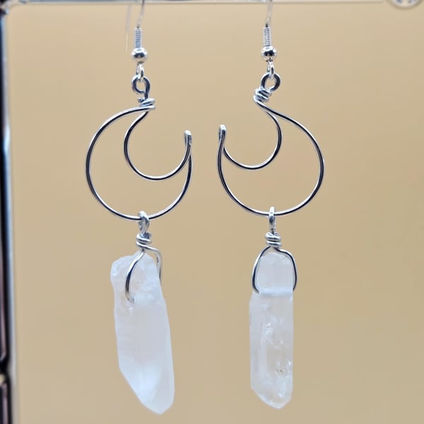 Sterling silver crescent moon dangle earrings with raw clear quartz points