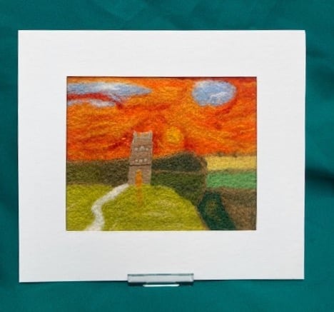 Felted picture of Glastonbury Tor at sunset.