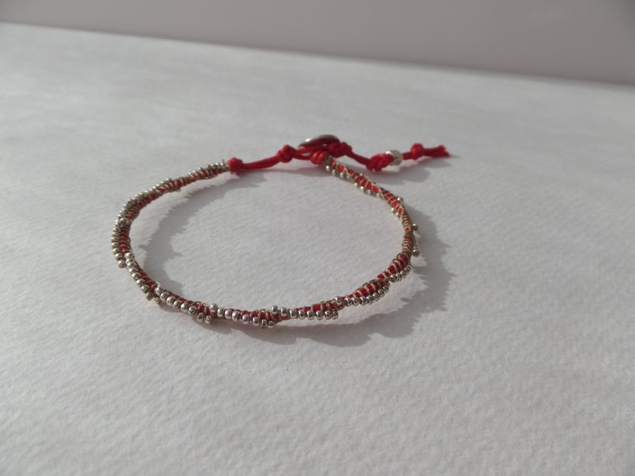 Silver Beaded Red Cotton Bracelet.