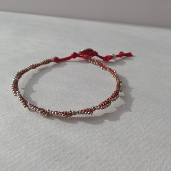 Silver Beaded Red Cotton Bracelet.