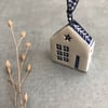 Ceramic hanging house decoration .