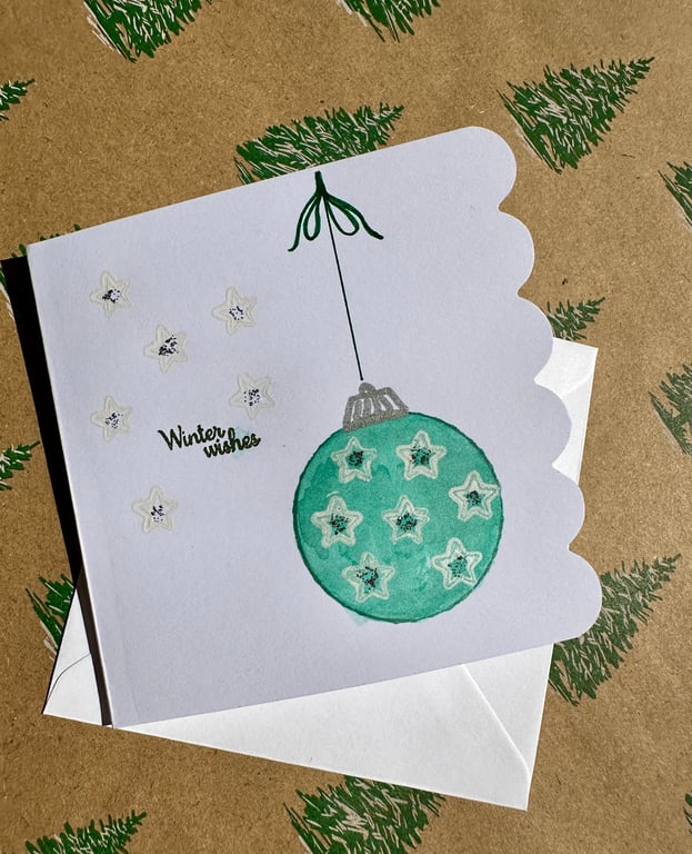 Water colour bauble Christmas card. sparkle, shimmer, stars, snowflakes 