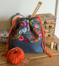 Drawstring project bag made with bright floral print in grey and orange - Image 7