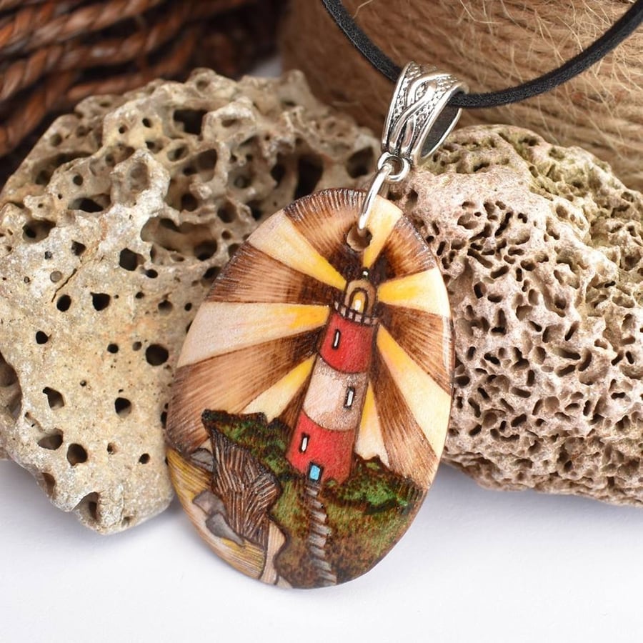 Lighthouse on the cliff top, wooden pyrography British coastline pendant