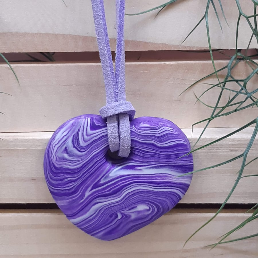 Purple and white heart shaped polymer clay pendant