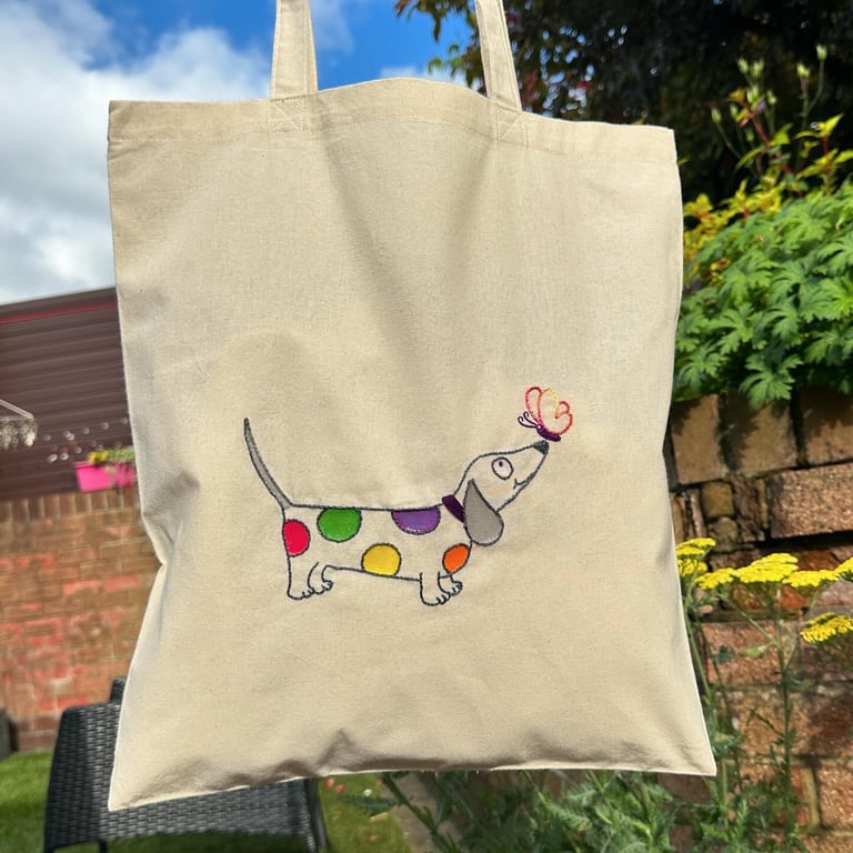 Canvas tote bag with a bright spotty sausage dog and butterfly embroidery